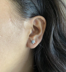 Small star studs with a 3 mm cz stone set in pure silver