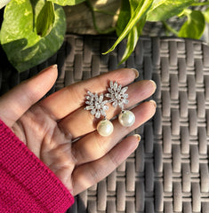 Uneven cz cut stone studs with pearl drops in pure silver