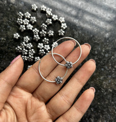2.5cm diameter thin balis with a flower bead in pure silver