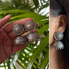 Antique finish Surya face studs with carving work jhumkas in pure silver