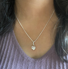 Paisley heart pendant with a single cz stone along with an 18'' chain in pure silver