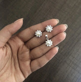 Compact 9mm diameter flower cz stone earrings and pendant set with a pearl center in pure silver