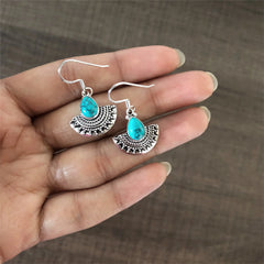 Pankhi pattern turquoise stone oxidized finish earrings in pure silver
