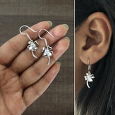 Delicate flower motif hangings with a cz stone in pure silver