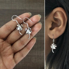 Delicate flower motif hangings with a cz stone in pure silver