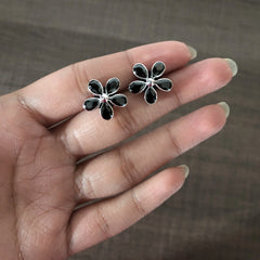 Black cz cut stone flower studs in pure silver