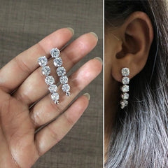 Five consecutive 3.3 cm long cz stone earring crafted in pure silver