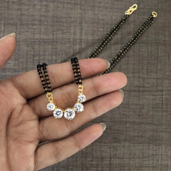 Five cz stone pendant in pure silver with 22 kt. gold plating suspended from an 18'' artificial chain