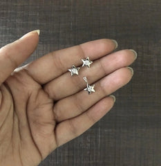 Small star shaped earring and pendant set with a 3mm cz stone in pure silver
