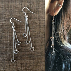 Heart cut out hanging earrings in pure silver