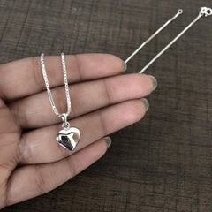 Hollow heart motif pendant with an 18'' chain in pure silver