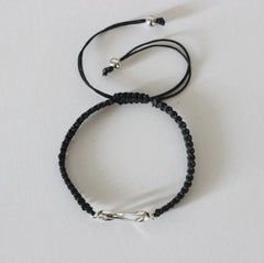Infinity motif adjustable hand braided bracelet made in pure silver