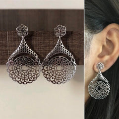 Intricate cut work dangling studs crafted in pure silver