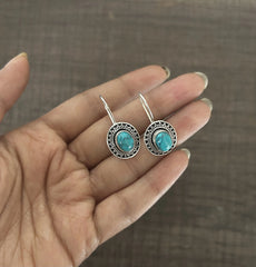 Oval rava work turquoise centre loops in pure silver