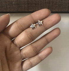 Small star studs with a 3 mm cz stone set in pure silver