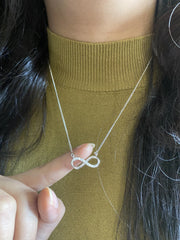 Infinity pattern pendant with cz stones and an 18’’ thin chain in pure silver