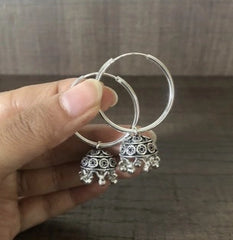 Light weight carving work jhumkas hanging from 3 cm thick plain balis in pure silver