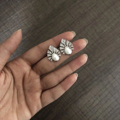 Multiple cz stone peacock feather motif earstuds with a pearl center in pure silver