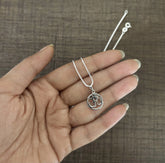 1.2cm diameter Om in circle pendant with an 18inch chain in pure silver