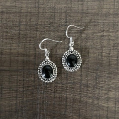 Oval black cabstone rava border hangings in pure silver