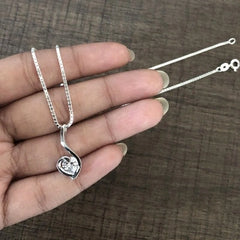 Paisley heart pendant with a single cz stone along with an 18'' chain in pure silver