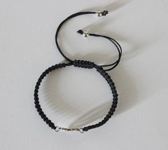 Pure silver adjustable Om motif hand braided bracelet