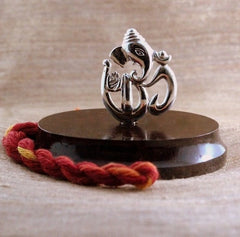 Pure Silver Om-Ganesha Idol on a rosewood base