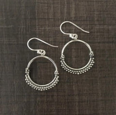 Rava work round hollow earrings in pure silver