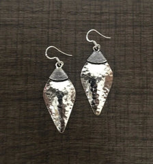 Shell shape beaten texture handmade earrings in pure silver