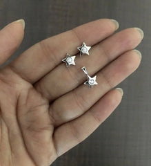Small star shaped earring and pendant set with a 3mm cz stone in pure silver
