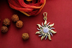 Surya motif with a cz stone pendant and 22 kt gold plating set in pure silver
