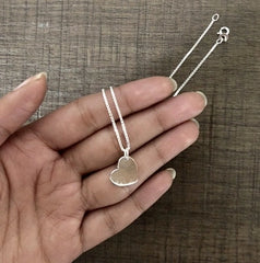 Tilted flat heart pendant with an 18'' thin chain in pure silver