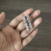 Five consecutive 3.3 cm long cz stone earring crafted in pure silver