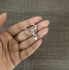 'V' with single cz stone earrings and pendant set crafted in pure silver