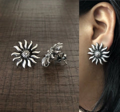 Antique finish 'Surya' motif studs in pure silver