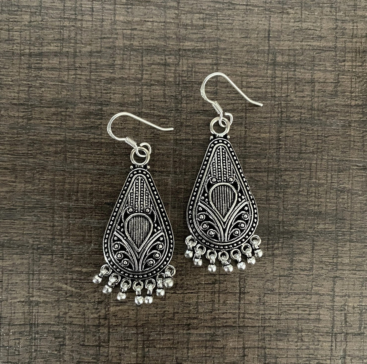 Antique finish carving and rava work hangings in pure silver