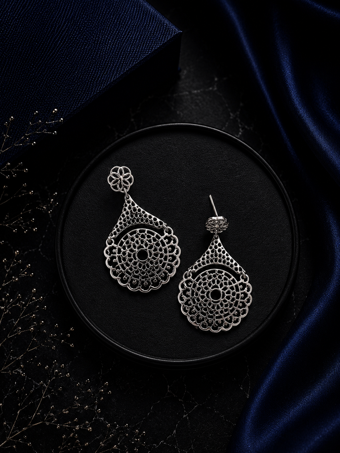 Intricate cut work dangling studs crafted in pure silver