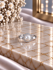 9mm diameter pearl ring with a cz stone border in pure silver