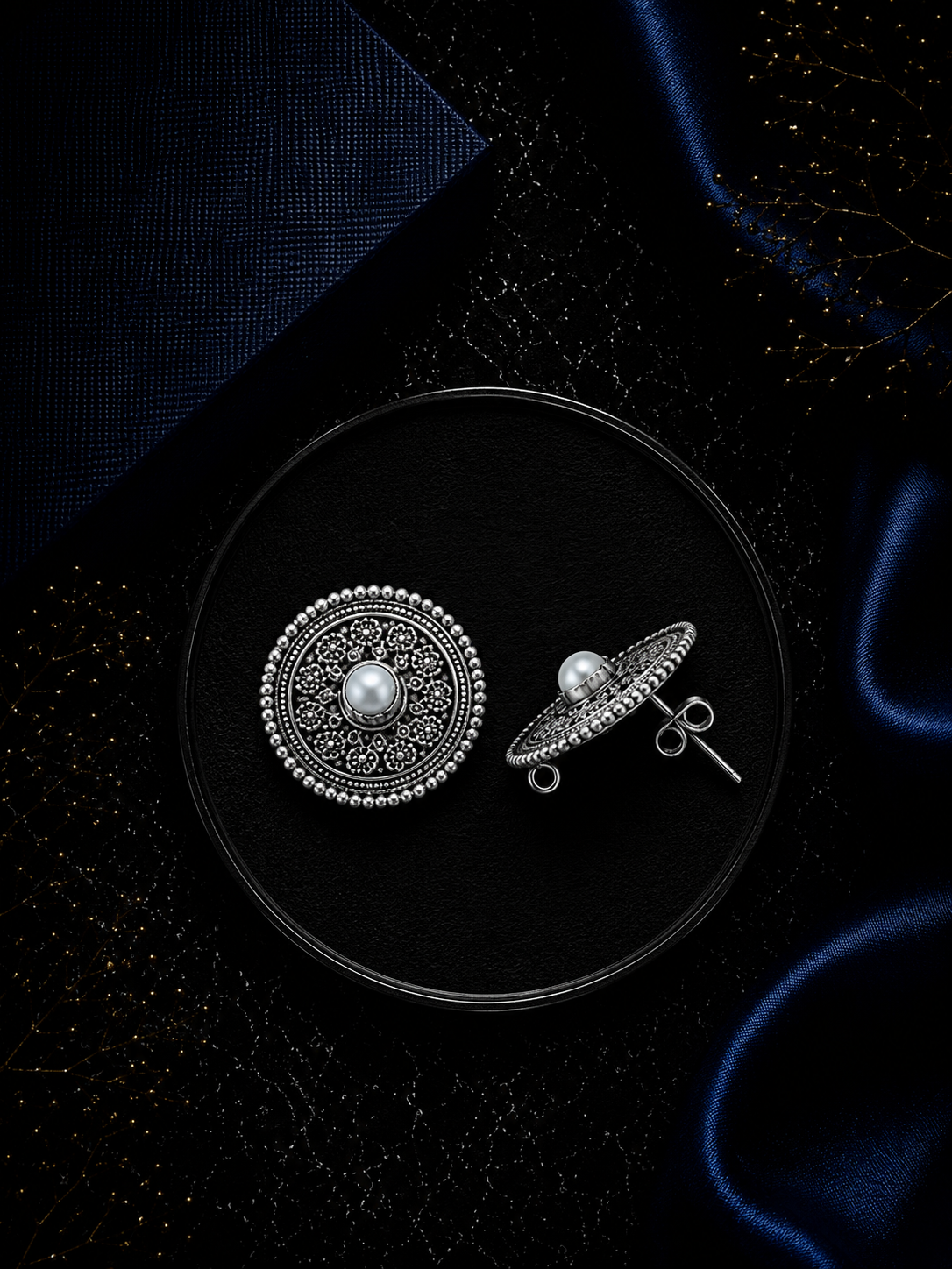 2.5 cm diameter rava work studs with a pearl center in pure silver