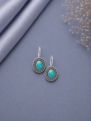 Oval rava work turquoise centre loops in pure silver