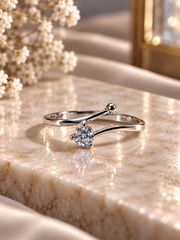 Single 4mm cz stone with a one side curved border ring in pure silver