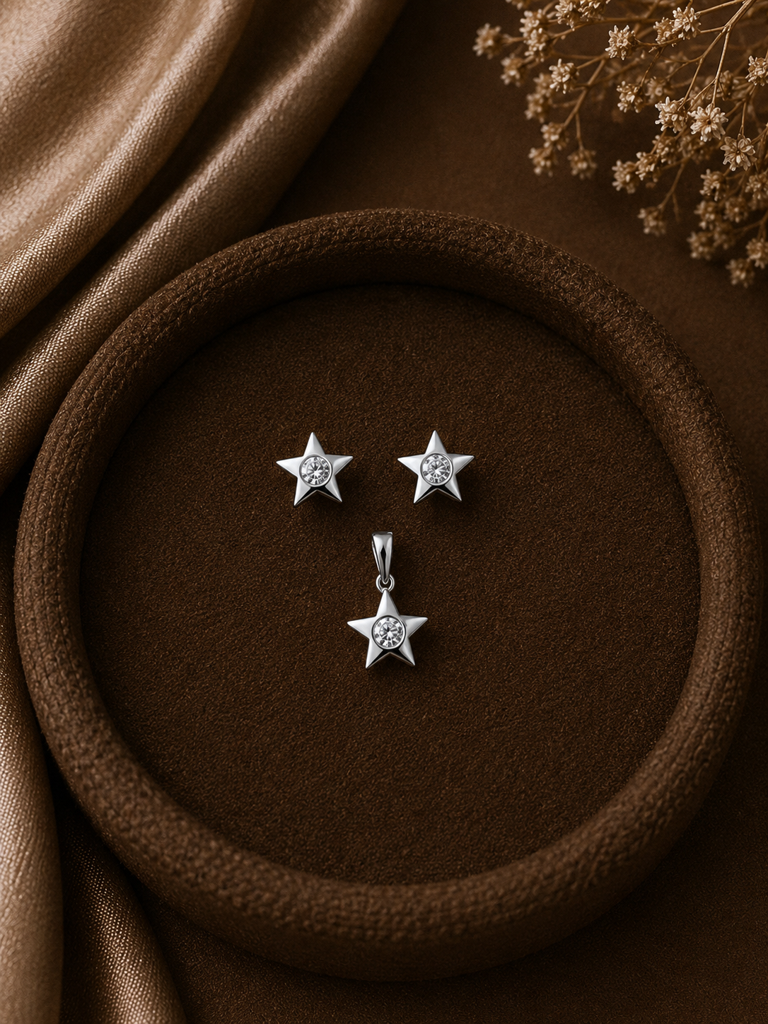 Small star shaped earring and pendant set with a 3mm cz stone in pure silver