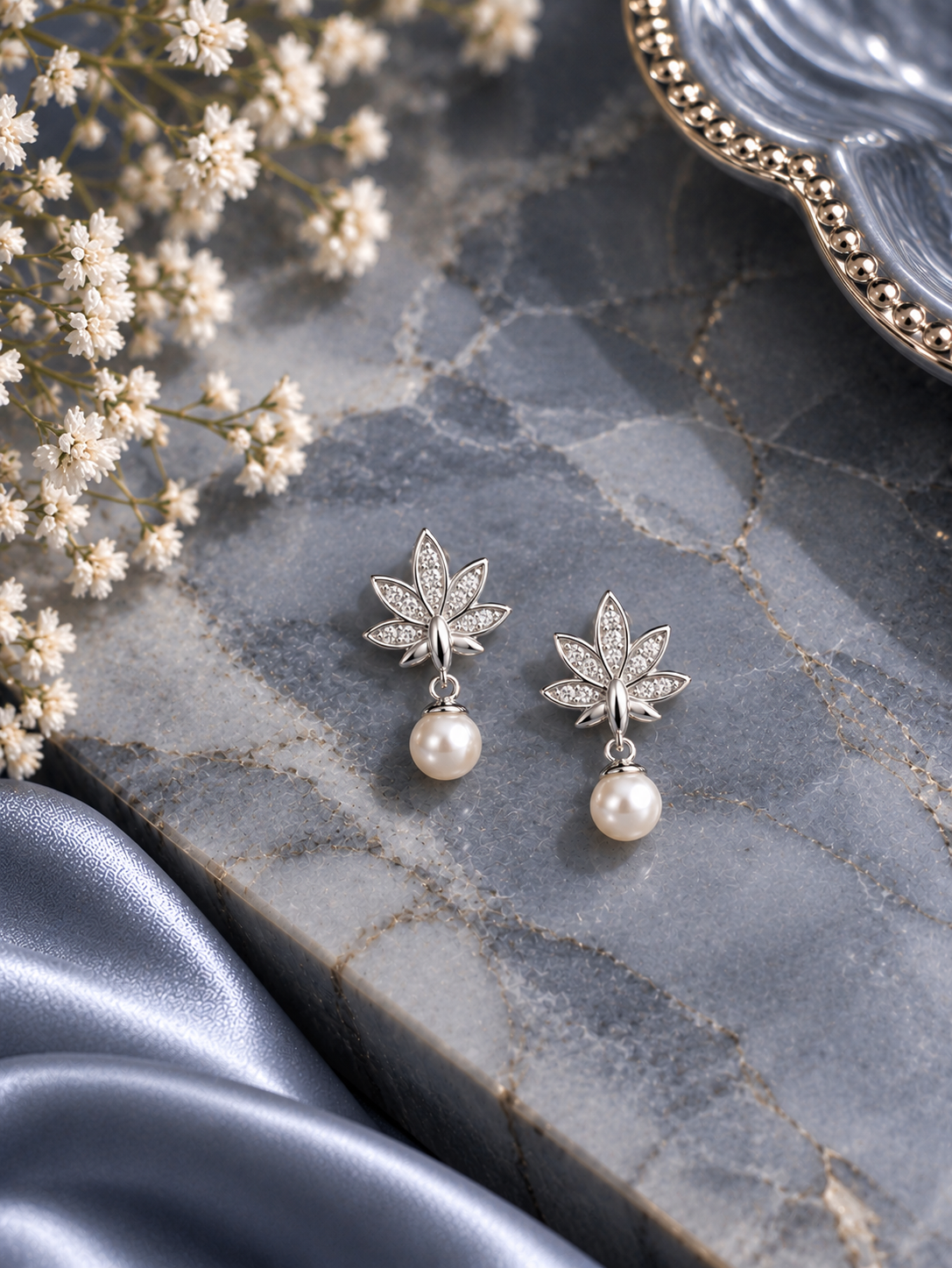 Lotus pattern cz studded earrings with small pearl drops in pure silver
