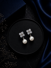 Four cz stone studs with round 10mm pearl drops in pure silver