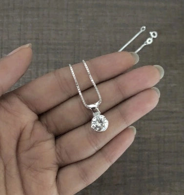 9mm diameter cz stone pendant with an 18'' chain in pure silver