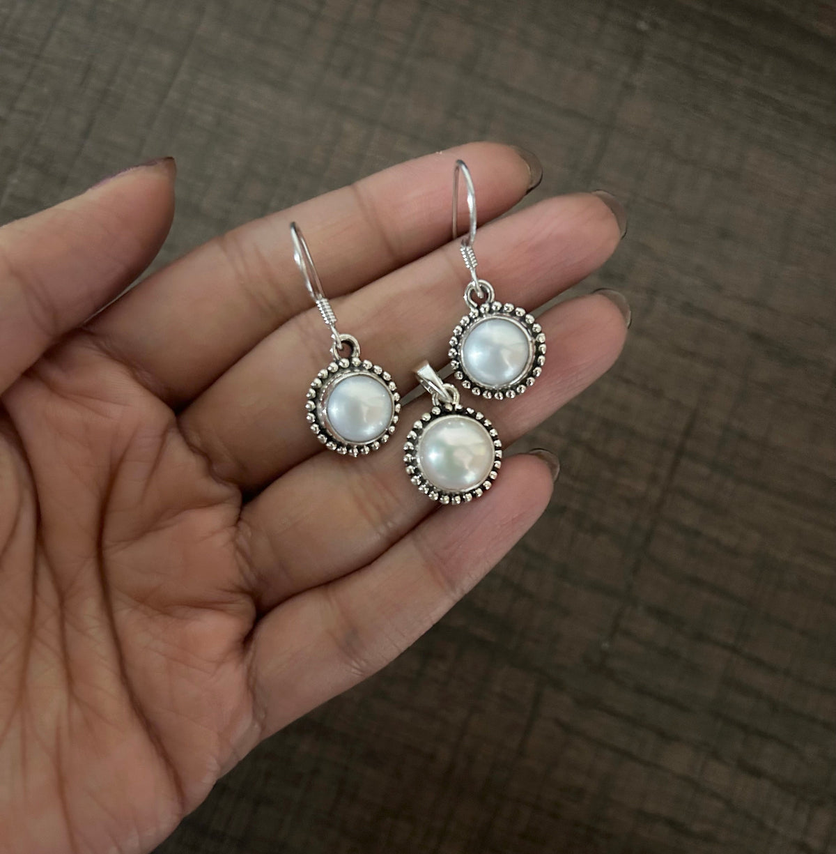 1.2cm diameter fresh water pearl rava work hangings with a matching pendant in pure silver