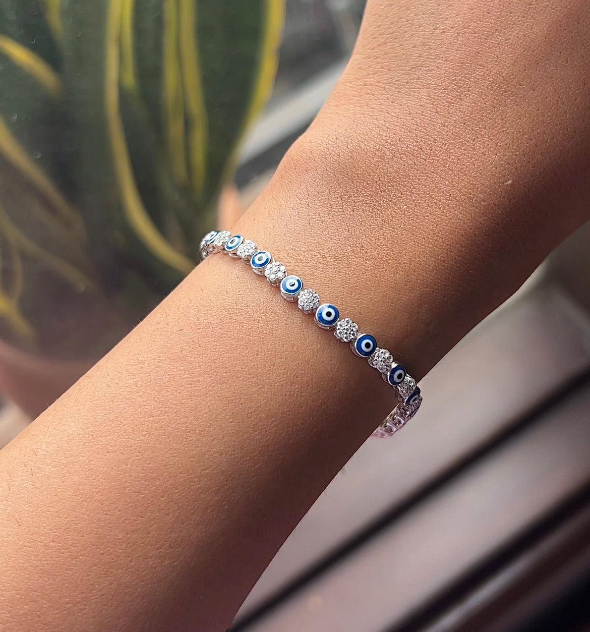 Evil eye with cz stones in flower pattern adjustable tennis bracelet in pure silver