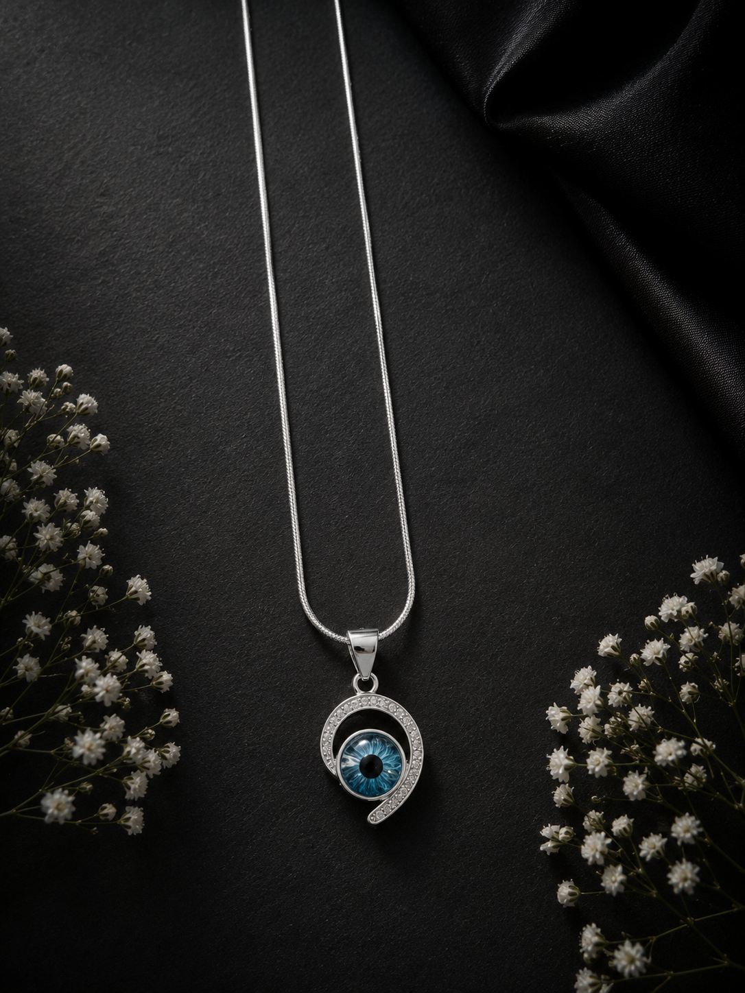 Designer studded curved evil eye pendant with a 20inch shiny chain in pure silver t