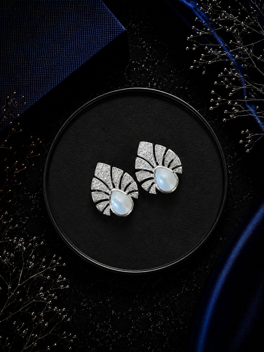 Multiple cz stone peacock feather motif earstuds with a pearl center in pure silver