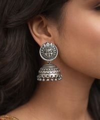 Antique finish Surya face studs with carving work jhumkas in pure silver